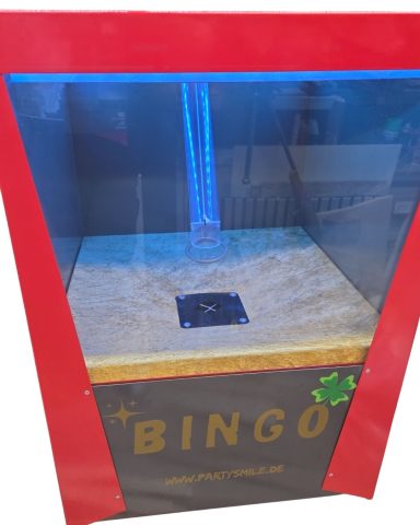 Ein Bingo-Spielautomat mit einer durchsichtigen Front und bunten Designelementen.
